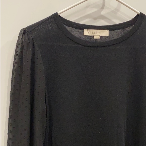 black sweater with sheer sleeves